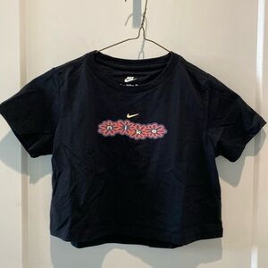 The Nike‎ Tee.  Kids Small.  Nike design across front.